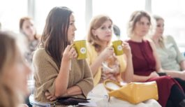 Women sitting down with coffee cup